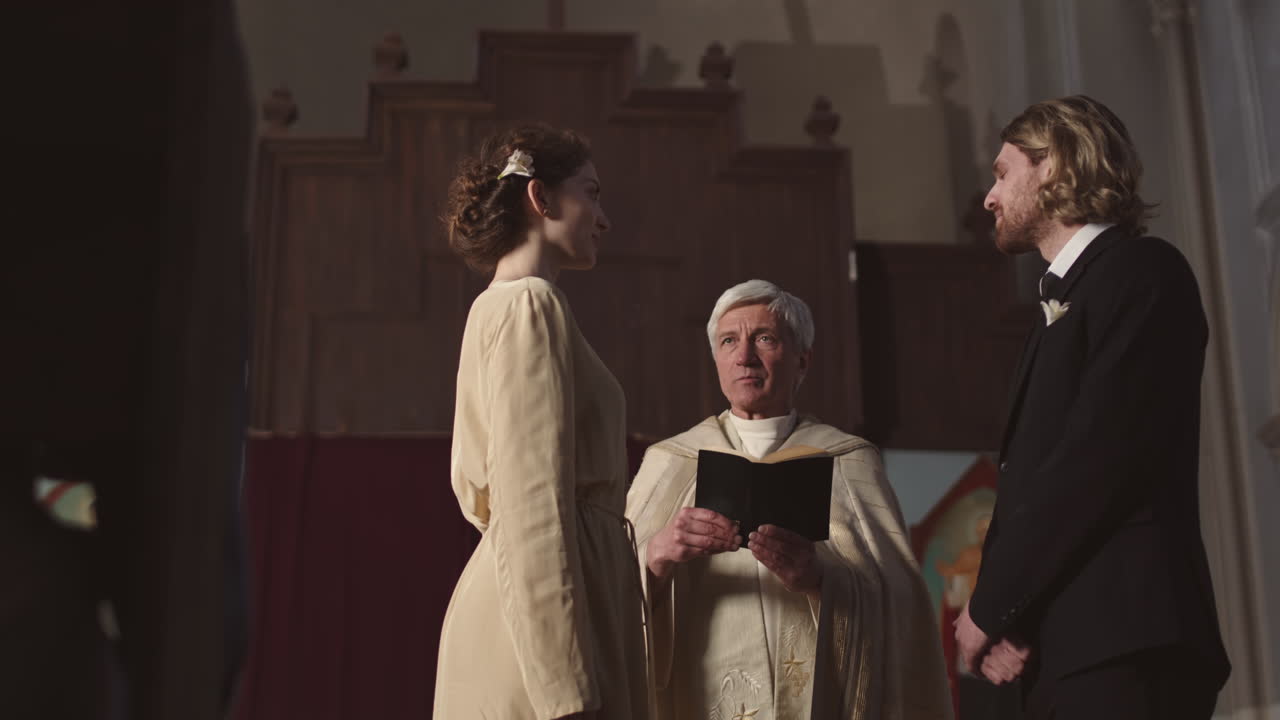 Bride and Groom Pronouncing Wedding Vows in Church