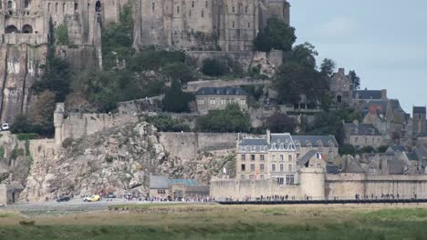 At-the-base-of-Mont-Saint-Michel-island-hill-popular-tourist-destination-in-Normandy,-France