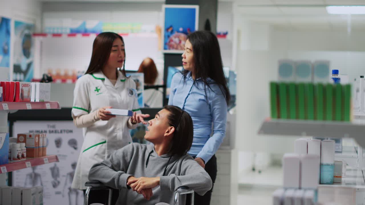 Healthcare professionals assisting a patient in a pharmacy