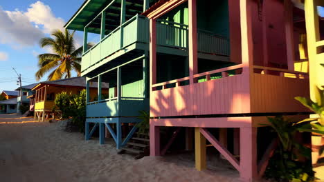 colorful beachfront cottages at sunset