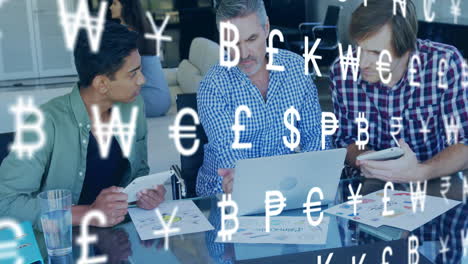 animation of currency icons over diverse colleagues using laptop in office
