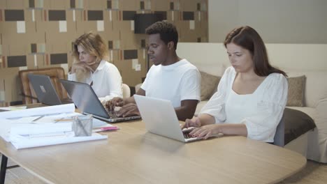 team of professionals sitting together at table