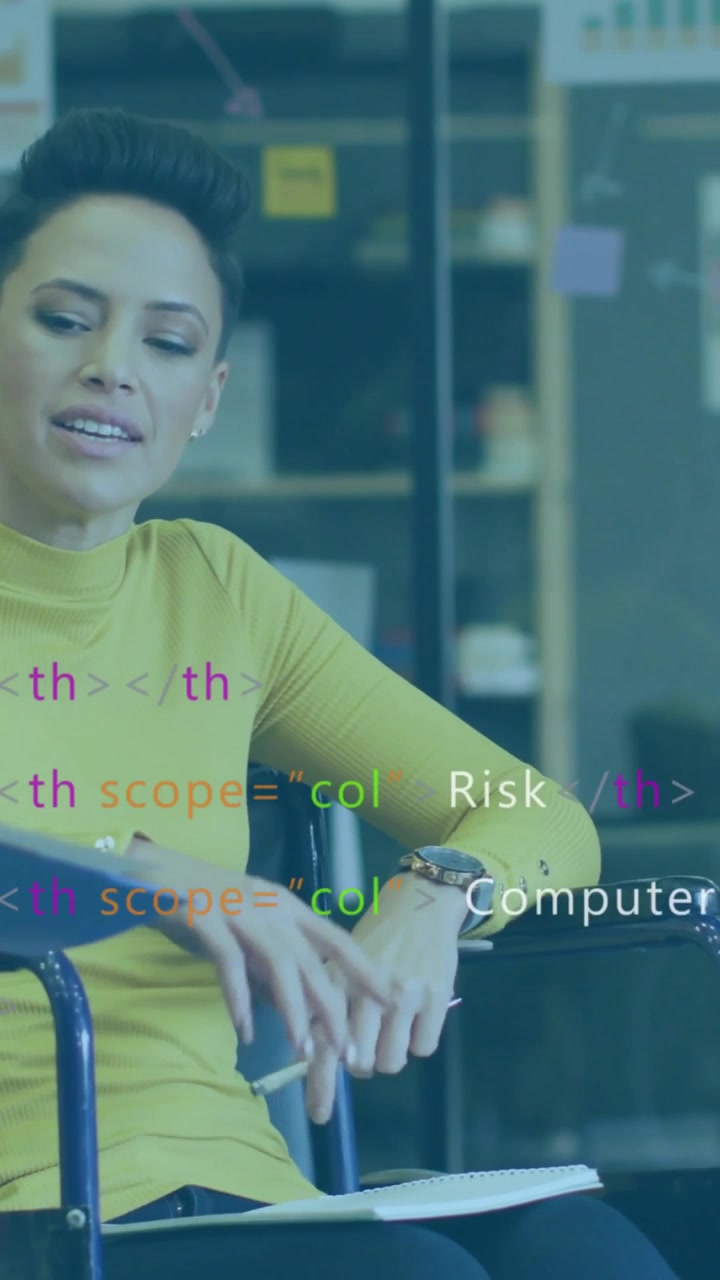 Vertical video: Reacting to overlays appearing, woman in yellow top gesturing with notes in meeting