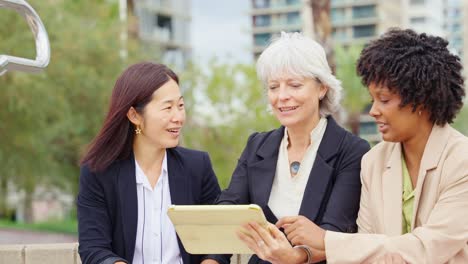 Businesswomen Collaborating with a Tablet