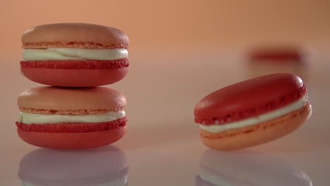 the macaroons are stacked on the table