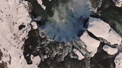 goðafoss waterfall, iceland, top down aerial view of natural landmark on sunny winter day