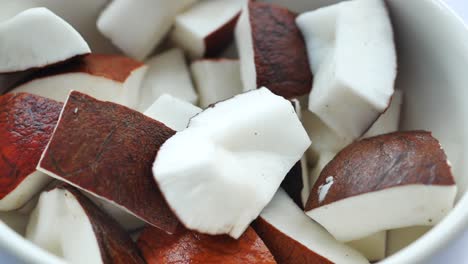 slice of fresh coconut on a table cloth