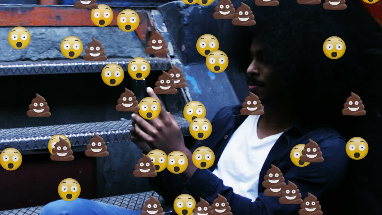 Animation of falling emojis over man using smartphone