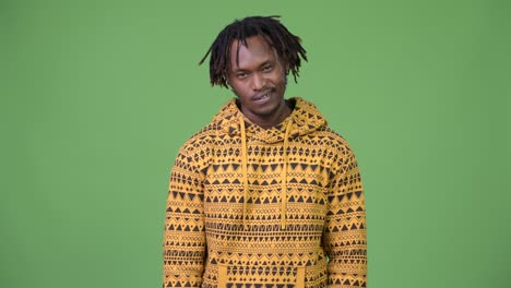 young handsome african man nodding head yes