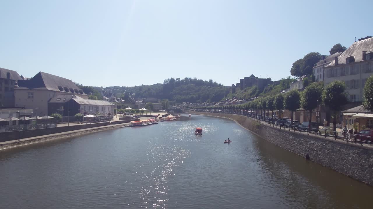 Boats and kayakers on river Semois in Bouillon. Famous city in the Belgian Ardennes, Belgium