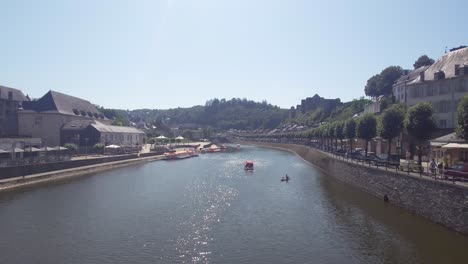boats and kayakers on river semois in bouillon. famous city in the belgian ardennes, belgium