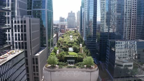 wide reverse pullback aerial shot of salesforce park on the roof of the transbay transit center in downtown san francisco, california