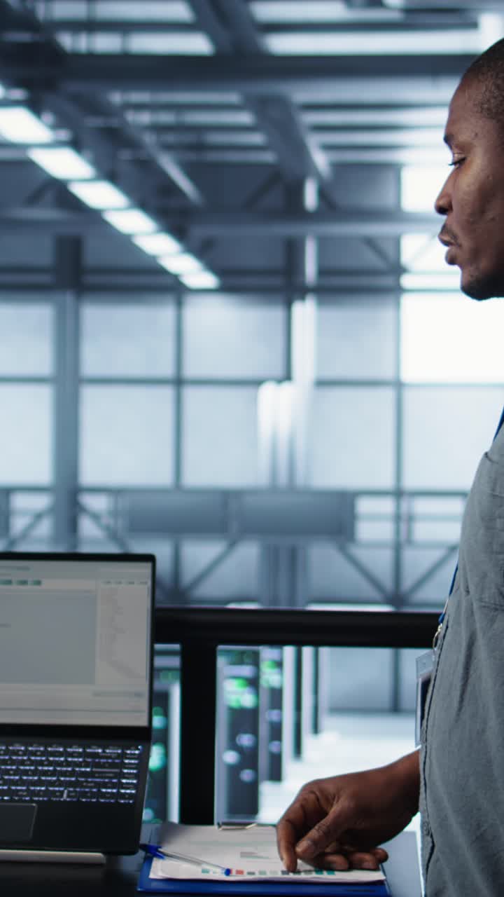 Vertical video Server room coworkers using artificial intelligence on laptop and tablet