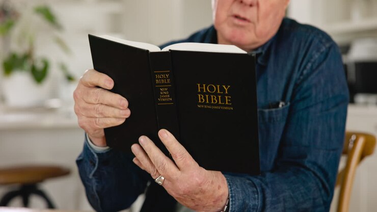 Senior man, hands and bible study with reading