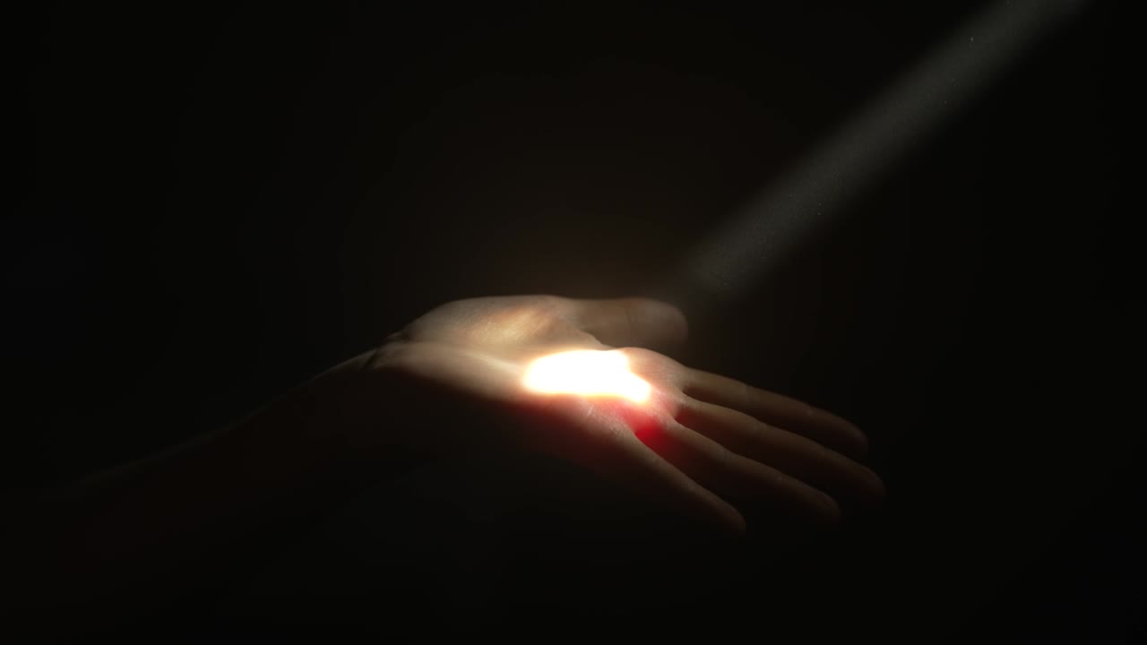 Woman touches a ray of light