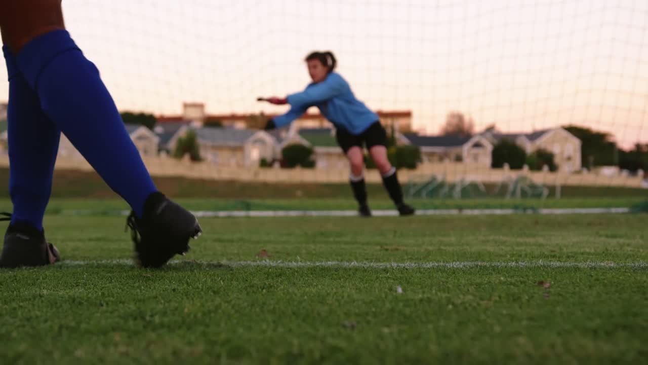 Female keeper waiting for female soccer player to kick the ball. 4k