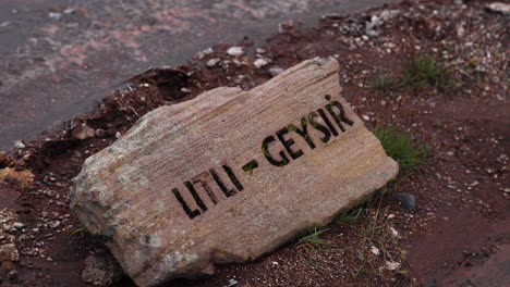 sign for litli-geysir carved into a rock iceland