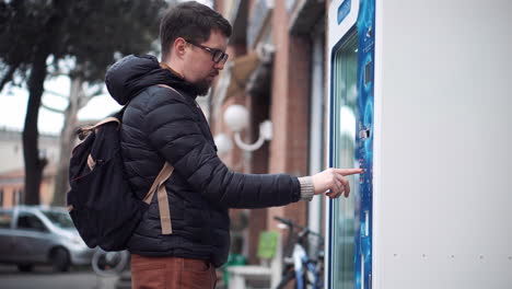 man using a vending machine