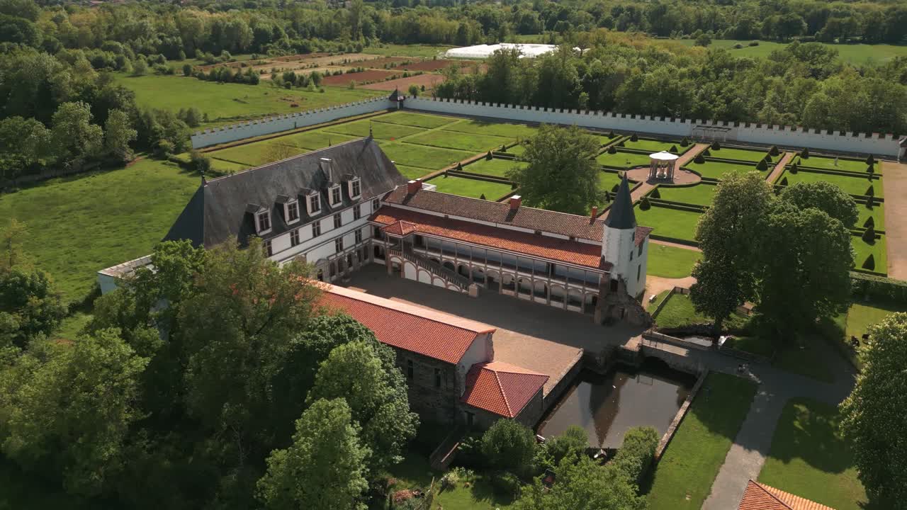 aerial shot around batie d'urfe castle in Saint Etienne le Molard in Loire departement on a suny day of spring, Auvergne Rhone Alpes departement, France