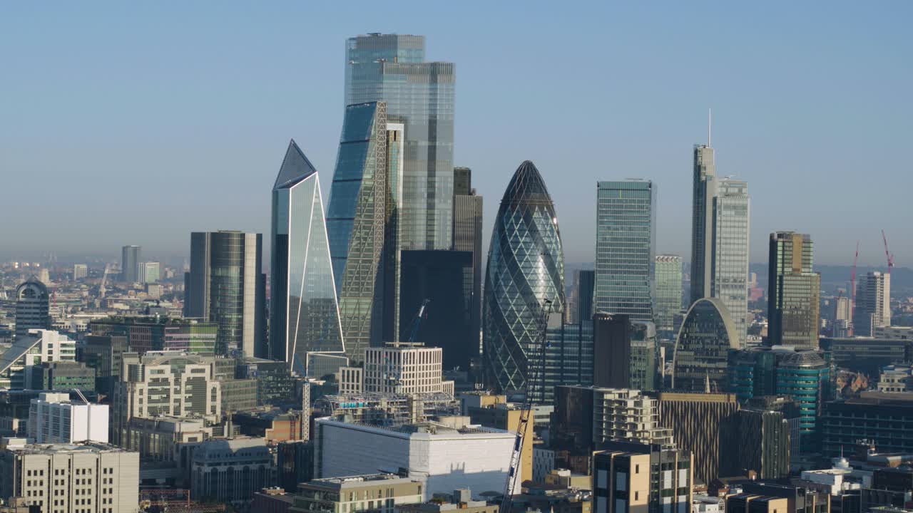 Aerial establishing dolly left shot of the City of London scrapers