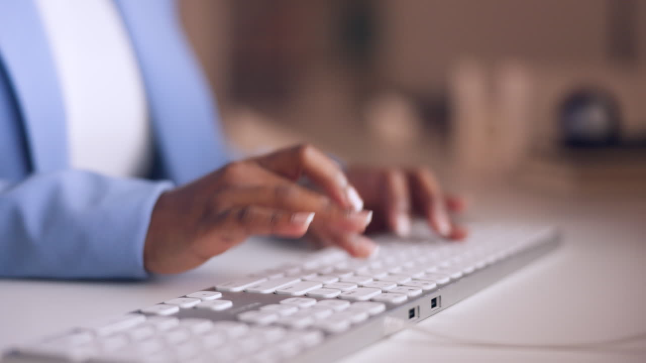 Hands, typing and keyboard with a business woman