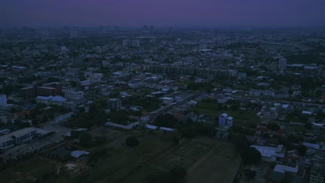 skyline timelapse of suburban bangkok with pink sky becoming night