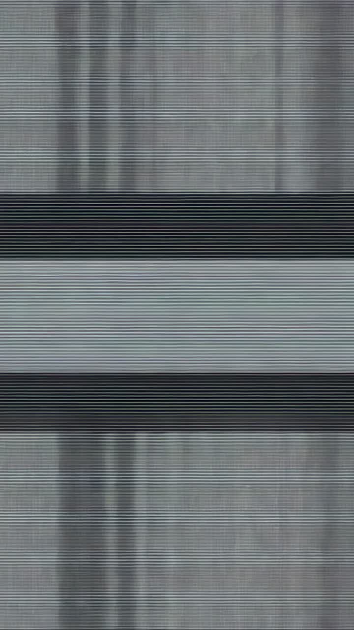 Vertical video: Displaying gray static flickering across screen, showing white band then reverting