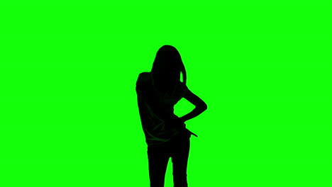 silhouette of woman doing disco gesture on green screen