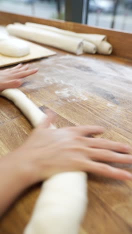 rolling dough in a bakery