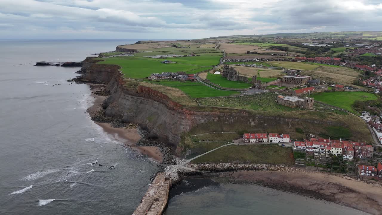 Aerial drone view Whitby Abbey north yorkshire british english seaside port harbour town city england uk