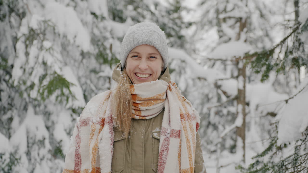 Happy Woman in Snowy Forest