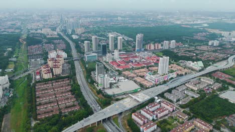 aerial view of petaling jaya near kuala lumpur, malaysia, showcasing residential towers, commercial buildings, highways, and expansive urban development.