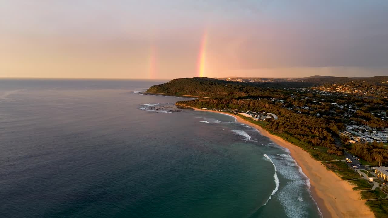 Aerial drone beautiful morning double rainbow shot of coastline headland Central Coast Shelly beach tourism travel NSW Australia 4K