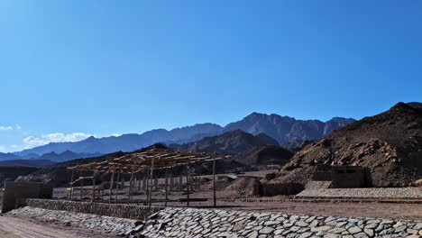 capturing of arid hills during daytime in egypt against blue sky.