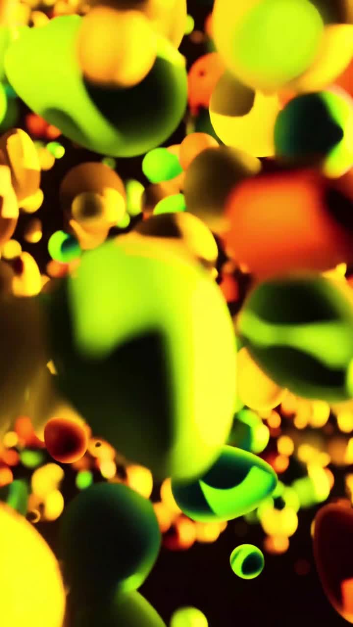 Dynamiske abstrakte klatter af gul, grøn og orange væske