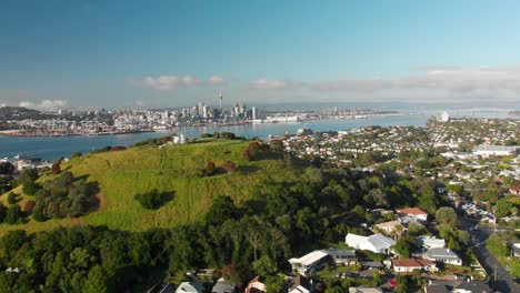 slowmo - aerial shot of auckland sky tower and skyline, new zealand