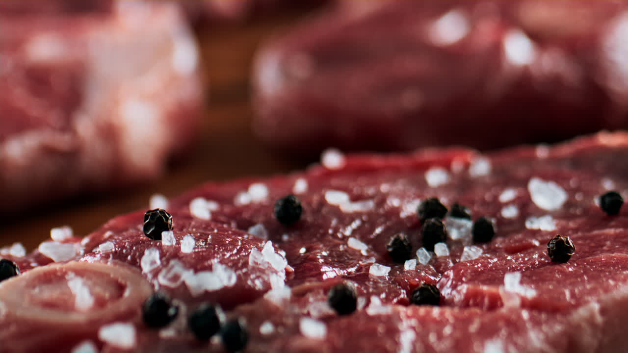 Raw Beef Steak with Salt and Pepper