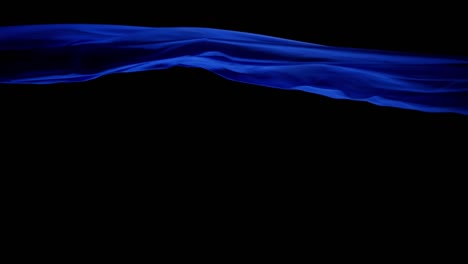 Royal-Blue-Silk-Cloth-Blown-By-The-Wind-With-Black-Background---studio-shot