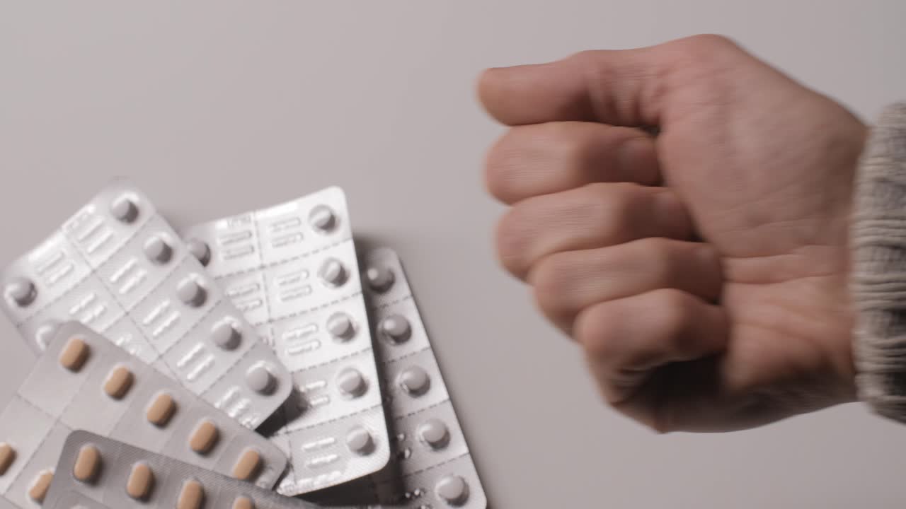 Different kinds pills in men's palm.