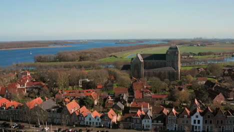 aerial: the historical town of veere with an old harbour and churches, on a spring day