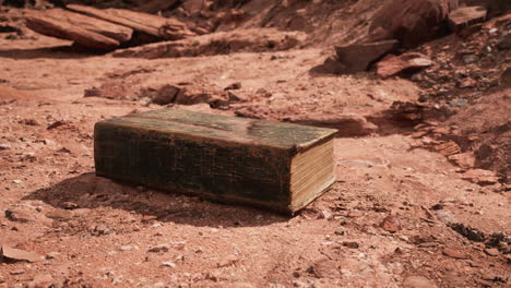 old book in red rock desert