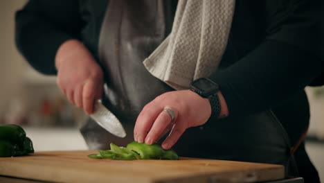 chef chopping green peppers