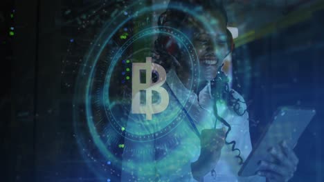 Animation-of-bitcoin-and-data-over-african-american-female-it-engineer-by-computer-servers