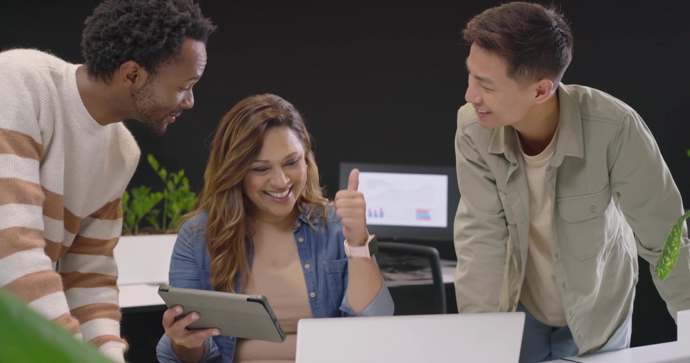 Diverse Team Collaborating on Project in Modern Office