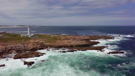 South-Africa-Lighthouse-Cape-St-Francis-close-up-summer-Garden-Route-aerial-drone-cinematic-Still-Bae-George-stunning-beautiful-late-afternoon-sunny-rugged-coast-waves-seagull-birds-circling