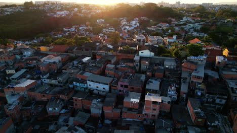 drone shot tilting over a poor neighborhood in sao paulo, sunny evening in brazil