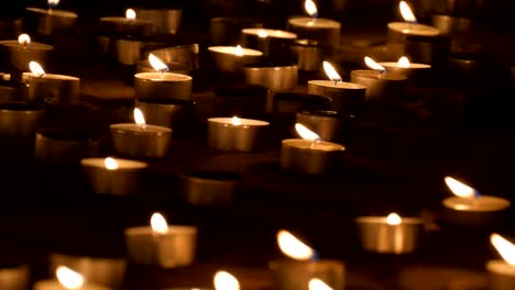 candles burning on the sand