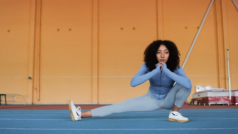 Woman-stretching-indoors