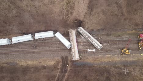 train crashed and derailed in woodland area, aerial top down view