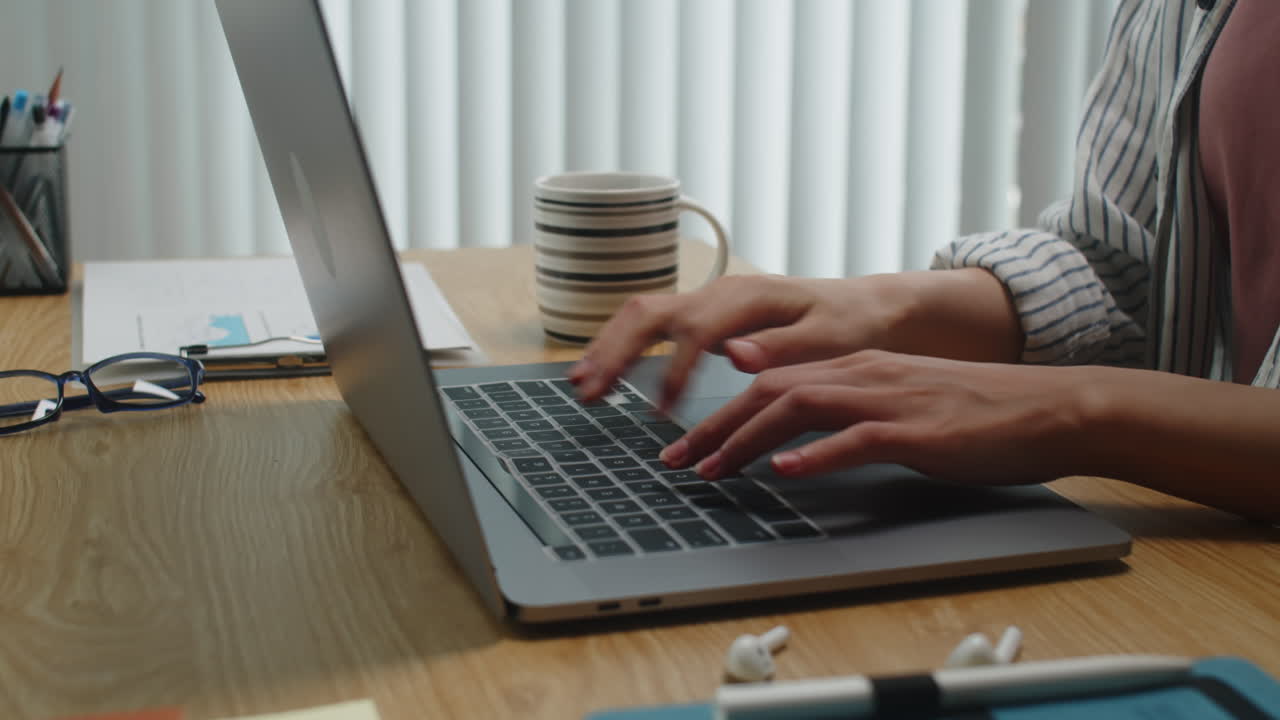 Female Entrepreneur Working on Laptop and Drinking Tea